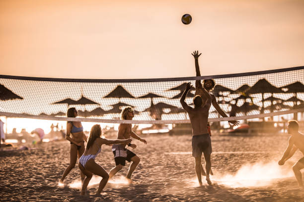 istock Playing volleyball on the beach at sunset! 1131993385