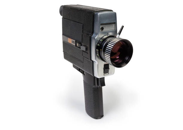 Old amateur electric film movie camera on a white background Old amateur film movie camera Super 8 mm format driven by electric motor on a white background vintage amateur movie camera stock pictures, royalty-free photos & images