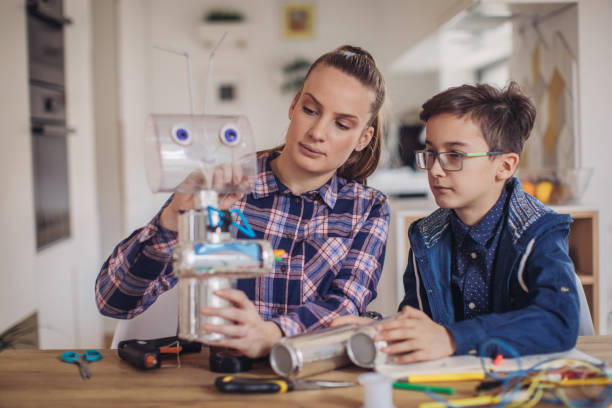 istock Sister and little brother constructing a robot at home 1131997093
