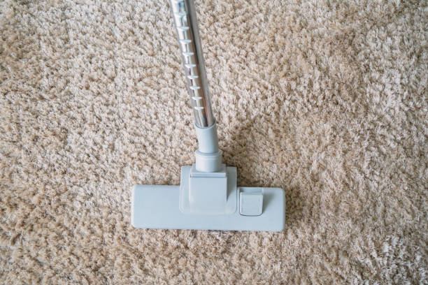 istock Modern vacuum cleaner vacuuming on carpet 1131997172