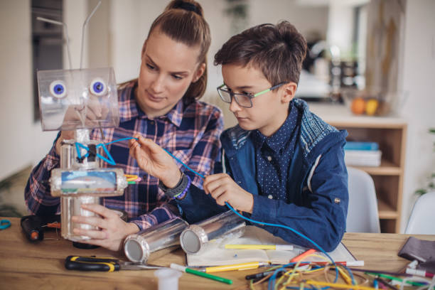 istock Brother and sister making a robot at home 1131997220