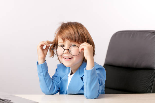 istock lauging young programmer sitting in the front of the laptop 1131998170