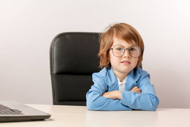 istock pleasant ginger boy with sceptic expression looking at the camera 1131998296
