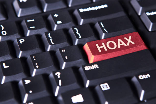 Computer keyboard with word of hoax Close up of a computer keyboard with word of hoax on the red button hoax stock pictures, royalty-free photos & images