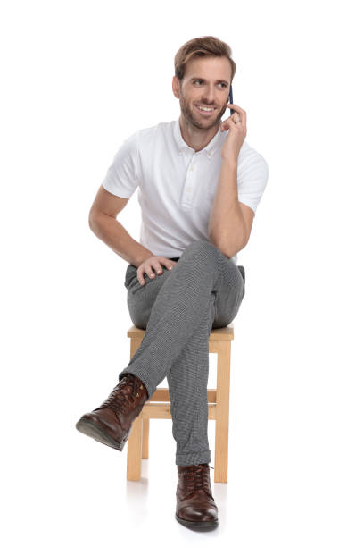 istock seated casual man talks on the phone 1131998910