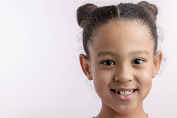 istock awesome African kid with positive expression is looking at the camera 1132000197