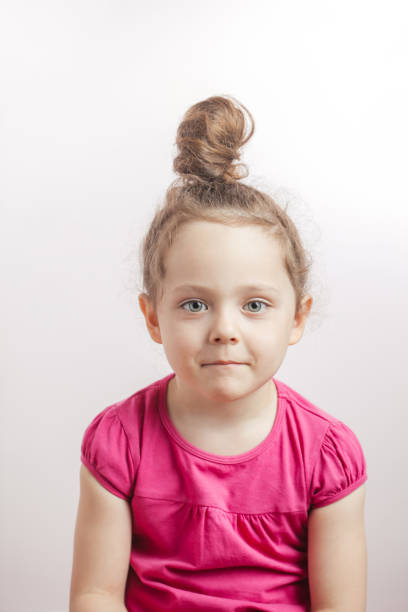 istock shy ginger girl with bun 1132002458