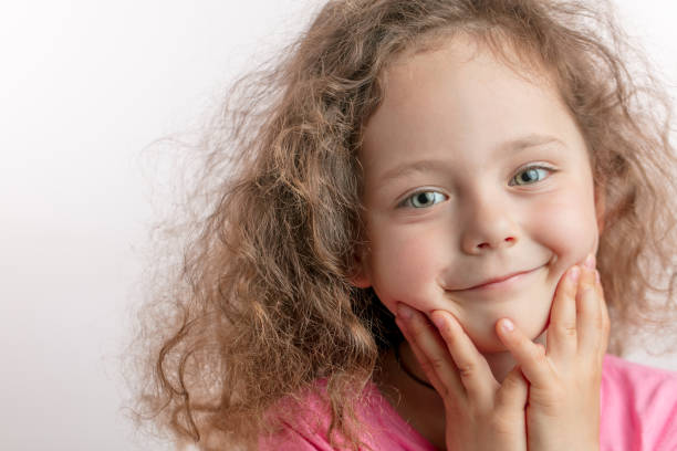 istock smiling beautiful ginger kid posing to the camera 1132002461