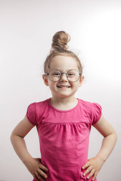 istock optimistic little girl wunderkindwith hands on the waiste 1132002473
