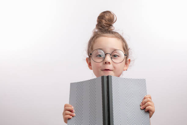 istock funny talented girl holding her dad's notepad 1132002505
