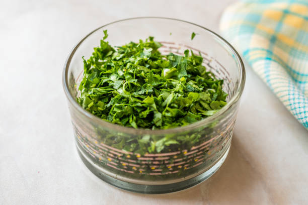 Chopped Parsley in Glass Bowl for Salad. Organic Food.