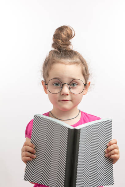 istock awesome little girl doesn't want reading 1132002509