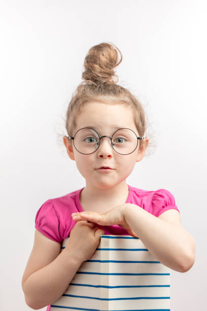 istock ginger good looking girl is hiding her picture in the notepad 1132002520