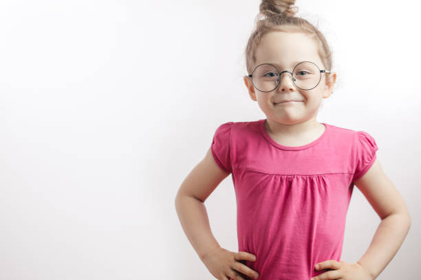 istock Cute ginger good looking little girl standing with hands on hips. 1132002557