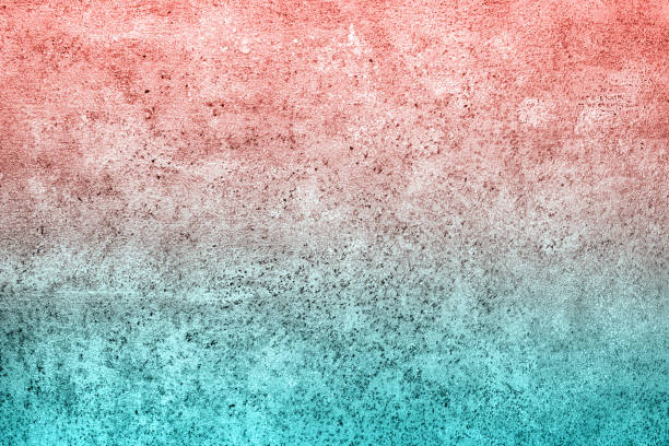 istock Turquoise living coral gradient concrete plaster background with small spots 1132003625