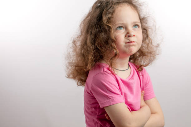 angru red-haired girl with frawning eyebrows is taking offence