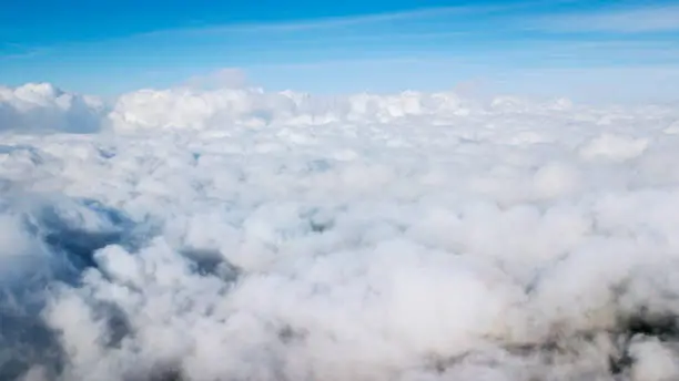 Aerial scenery of cumulus clouds with blue sky background