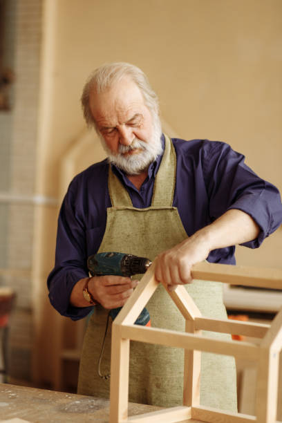 istock grandpa is making house for dolls 1132007765