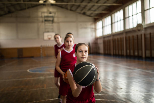 istock Teenage girls practicing free throws 1132010696