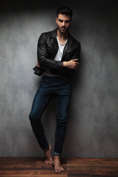 istock cool young man standing with hands crossed and bare feet 1132012199