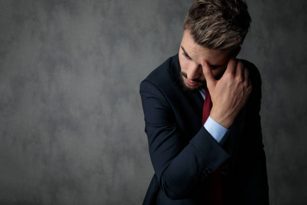 istock thoughtful young businessman looks to side, 1132013640