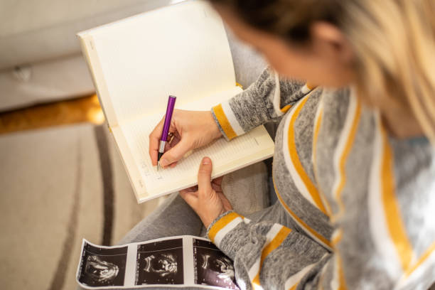 istock Pregnant woman making to do list 1132018413