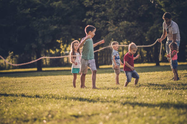 istock Group of children playing in public park 1132019593