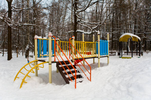 istock Playground in the winter park covered with snow. 1132019755