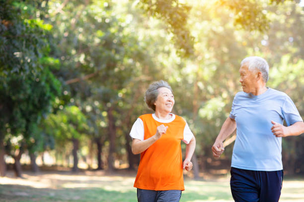 istock happy Senior couple running in the park 1132021785