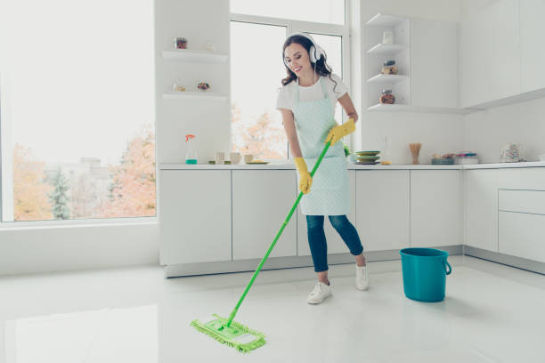 istock Full length body size side profile photo beautiful attentive hardworking nice pleasant duties she her lady house ear flaps head wear jeans denim casual t-shirt covered cute apron bright light kitchen 1132023094