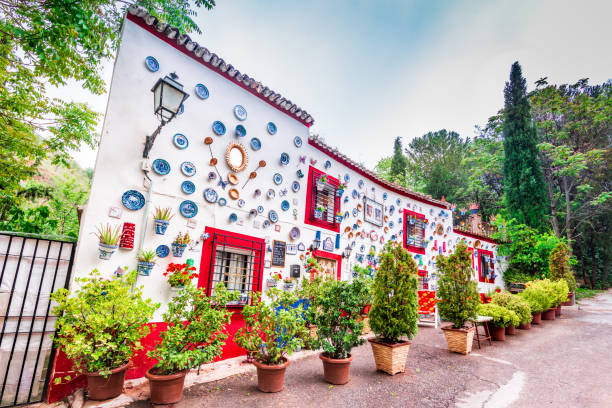 Granada, Andalusia, Spain Granada, Spain - May 2016. Casa la Sevillana, flowers decorated gipsy house in Sacromonte, Granada moorish city in Andalusia. spanish flower pots stock pictures, royalty-free photos & images