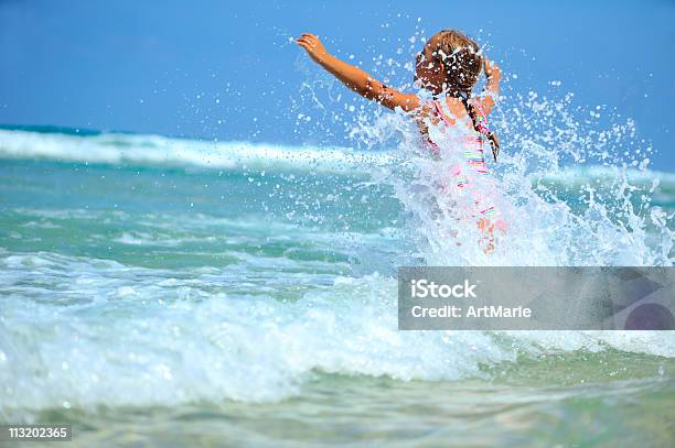 Happy Little Girl Having Fun In The Sea Stock Photo - Download Image Now - 6-7 Years, Beach, Beautiful People
