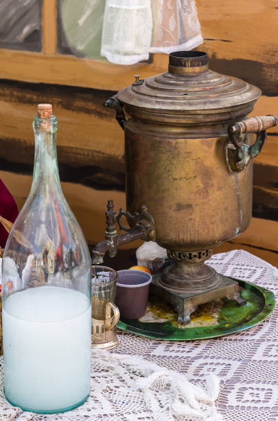 istock Samovar and moonshine bottle on a lace tablecloth 1132023859