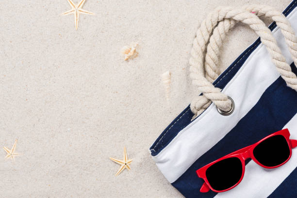 istock Beach bag on sandy beach, summer vacation background 1132025913