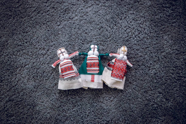 istock Three handmade dolls in the Ukrainian style on a gray background. Handwork. 1132026141