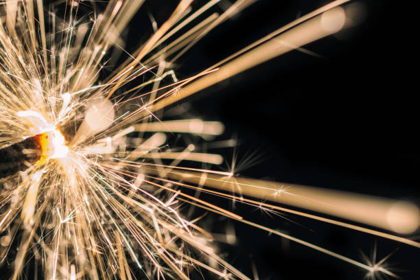 Sparkling sparkler in front of black background