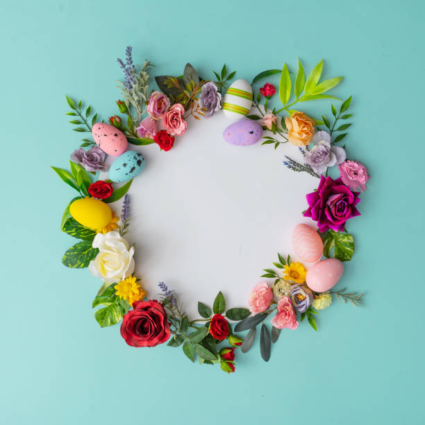 istock Easter wreath made of colorful spring flowers, leaves and easter eggs. 1132027697