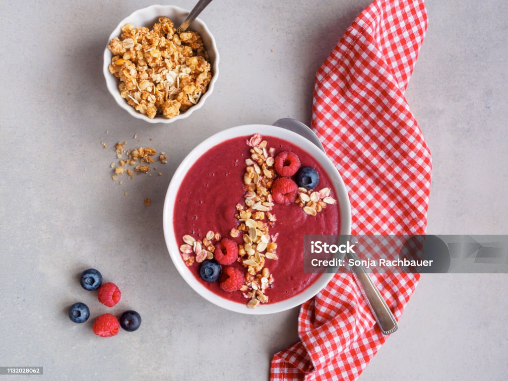 Red berries smoothie with cereal fruit, food, breakfast, top view, spoon, napkin, checkered, oatmeal, Smoothie Stock Photo