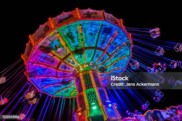 Chain Carousel At Night Stock Photo - Download Image Now - Traveling Carnival, Night, Amusement Park Ride
