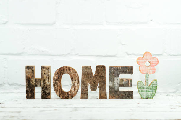 istock Letters wood with flower 1132031394