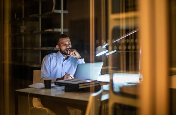 Overworked Businessman Working Late in The Office