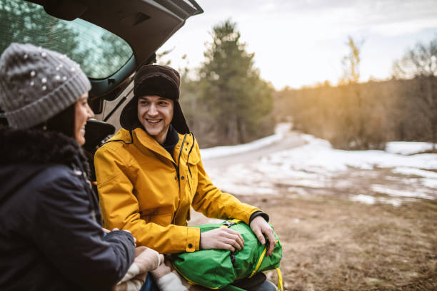 istock Yong couple resting on a car 1132034654
