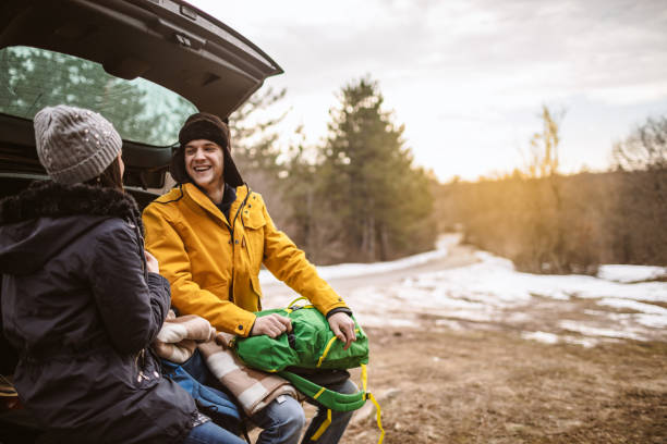 istock Yong couple resting on a car 1132034678