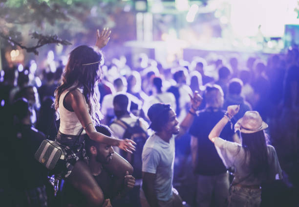 istock Happy friends having fun while dancing on a music festival. 1132037082