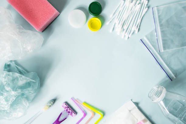 istock Disposable plastic items of every day use on blue background, top view. 1132037242