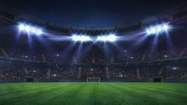 grand football stadium illuminated by spotlights and empty green grass playground - grass area flash imagens e fotografias de stock
