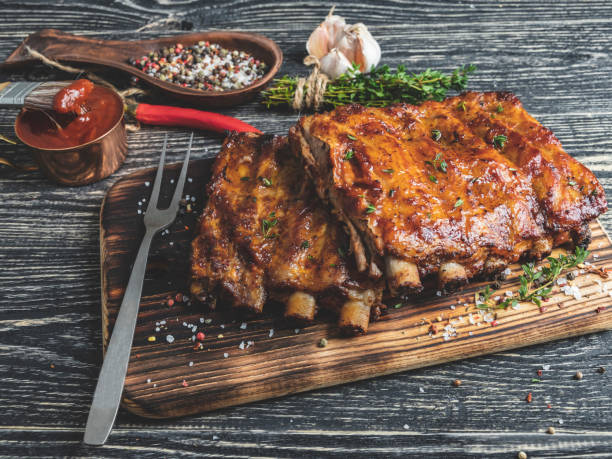 istock grilled pork ribs with sauce on a cutting board 1132039067