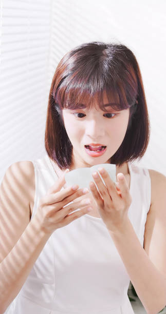 istock woman use oil blotting paper 1132039423
