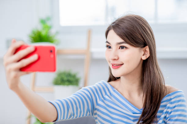 istock Asian girl selfie happily 1132040238