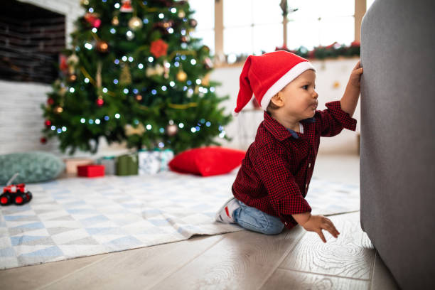 istock Little Santa helper crawling on floor 1132040662